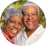 Smiling older man and woman outdoors