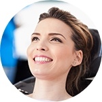 Woman in dental chair smiling during dental checkup