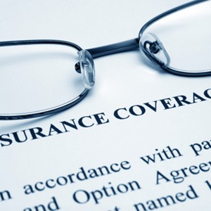Glasses on a dental insurance information sheet