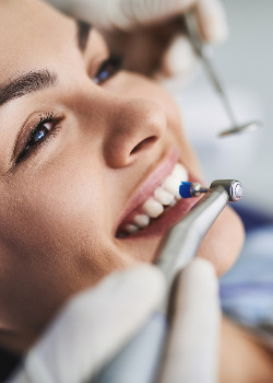 Woman having her teeth cleaned