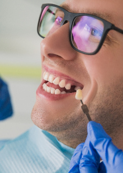 A man missing a tooth near West Newton