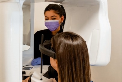 assistant giving x ray to patient