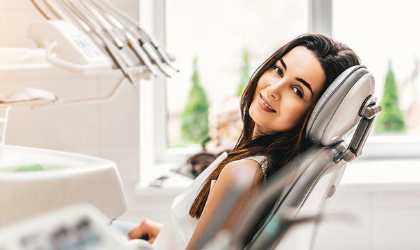 Smiling woman in dental chair