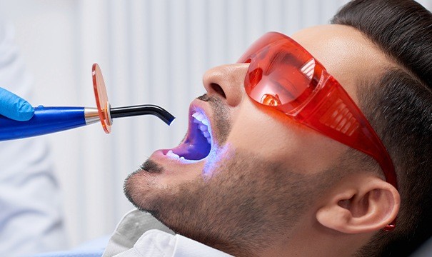 Man receiving dental sealants