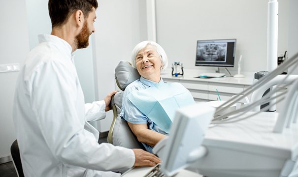 An older woman consulting her dentist about a dental treatment