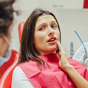 Woman with a toothache at the dentist