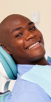 Smiling man in dental chair