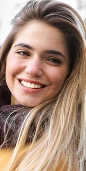 Woman sharing beautiful smile outdoors