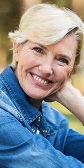 Older woman smiling outdoors