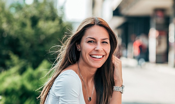 young woman smiling with porcelain veneers