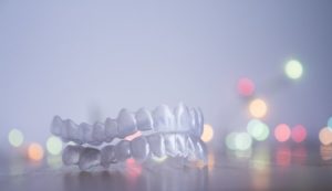 Invisalign in Newton with Christmas lights in the background