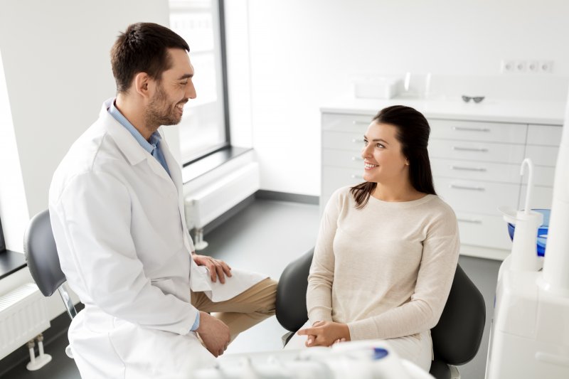 Woman smiling at cosmetic dentist